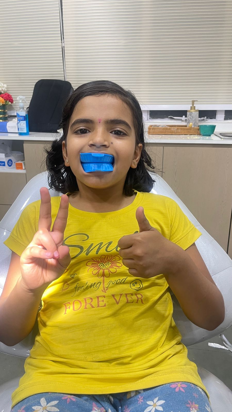 Smiling child after a fluoride application